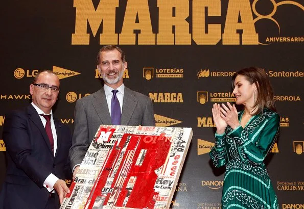 Queen Letizia wore a new scarf-print long dress by Sandro, with Prada pumps for Marca's lunch at Royal Theatre