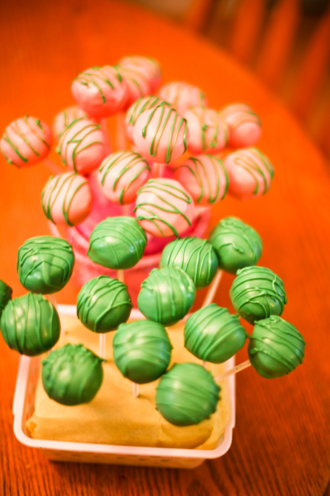 Pink Frosting Bakery Pink and green cake pops
