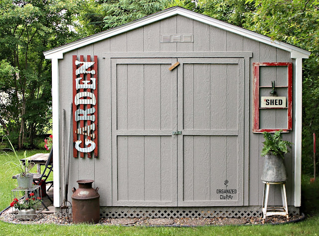 Decorating a Home Depot Shed Kit with JUNK #junkgarden #gardenjunk #flowergarden #containergarden #oldsignstencils #stencils