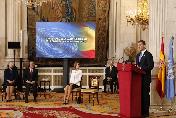 Secretary-General of the United Nations Ban Ki-moon, his wife Yoo Soon-taek Spain's King Felipe VI and Spain's Queen Letizia listen to the Spanish national anthem at the Royal Palace