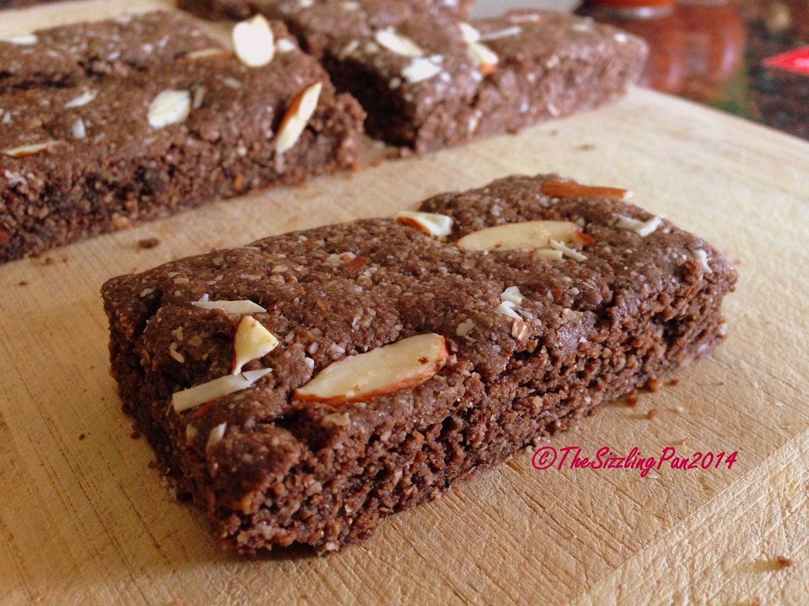 The Sizzling Pan OatsAlmond Breakfast bars (Eggless)