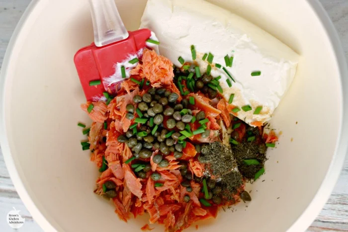 Easy Smoked Salmon Dip being mixed in a white bowl