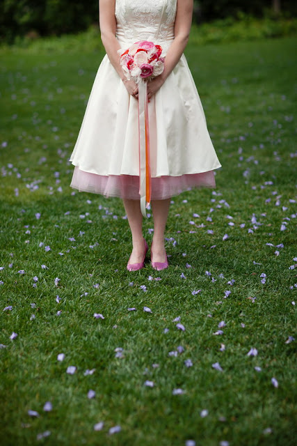 Bride with ribbons on bouquet