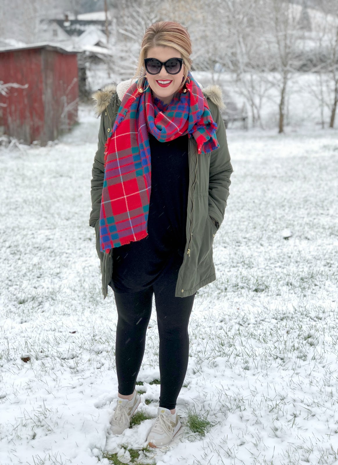 Red plaid scarf, green parka with fur