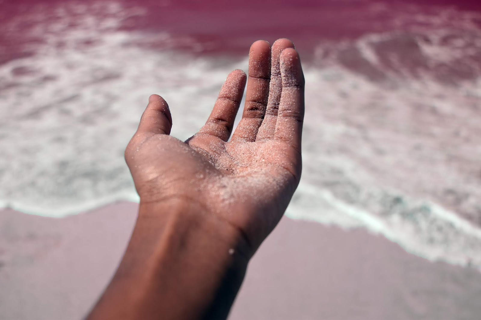 Mãos na praia