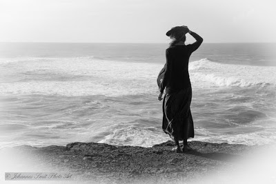 Woman looking out to sea