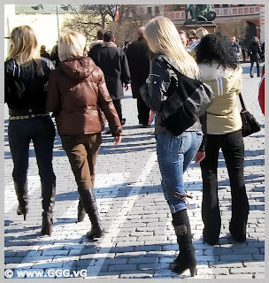 Girls in high heel boots on the street