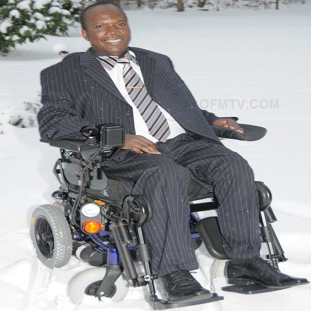 Apostle Dr Michael Kwabena Ntumy in electronic wheelchair