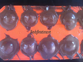 Celebrate Halloween with this sweet Pumpkin candy recipe.  These chocolate covered cherries are in the shape of pumpkins using a cheap dollar store mold and an easy candy recipe.  These chocolate candies are perfect for any fall holiday including Halloween and Thanksgiving, or just a more beautiful take on the store bought chocolate covered cherries.