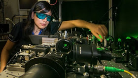 Rocio Camacho-Morales, a PhD candidate at the Australian National University. Here she adjusts the laser equipment in the laboratory of the Nonlinear Physics Centre at the ANU ~ PHOTO: ANU