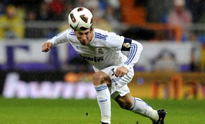 Sergio Ramos as captain of Real Madrid heading a ball