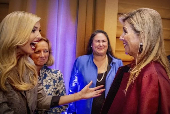 Queen Maxima wore Burberry London trench coat, she wore Natan dress and Gianvito Rossi pumps. Ivanka Trump at a initiative meeting