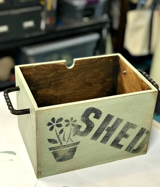 Rustic flower box for flowers with a stenciled Shed design