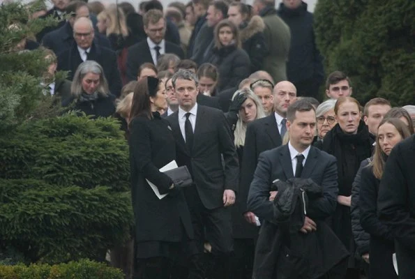 Count Frederik Christian Adam Moltke's funeral service at Tureby Church. Crown Princess Mary wore Hugo Boss coat