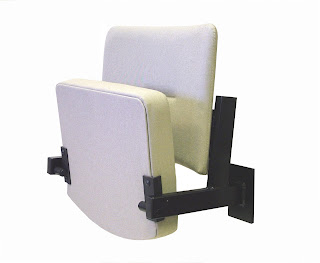 DDA compliant, flip-up wall-mounted seat in white vinyl