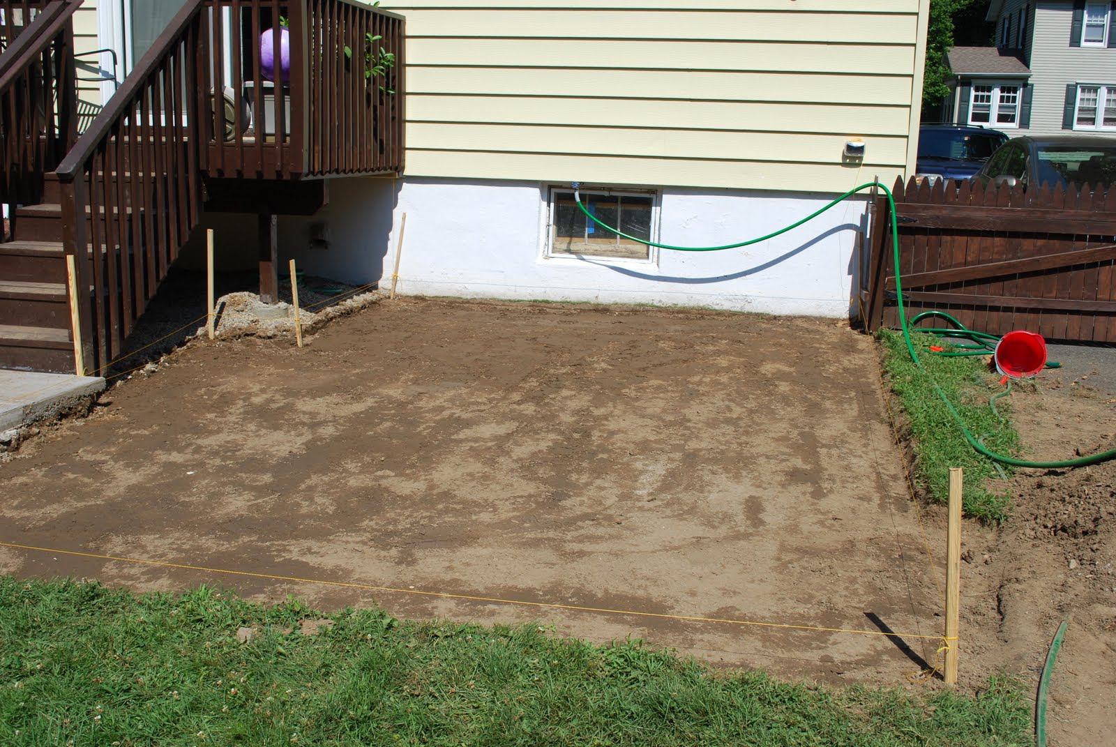 In the Little Yellow House Patio Building Dirt Tamping