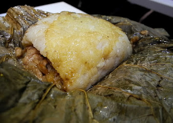 Law Mai Gai: Savoury chicken and sticky rice wrapped in lotus leaf