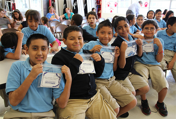 KIPP Courage College Prep at Landrum Middle School holds special ribbon KIPP Courage College Prep at Landrum Middle School holds special ribbon