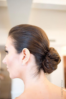Courtney shows off her low bun at her NY Athletic Club Wedding