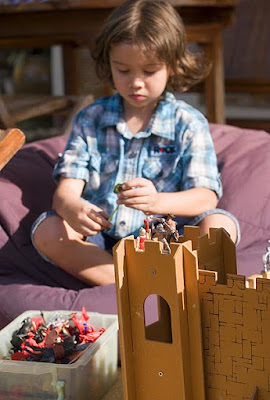 My Boy playing with wooden castle