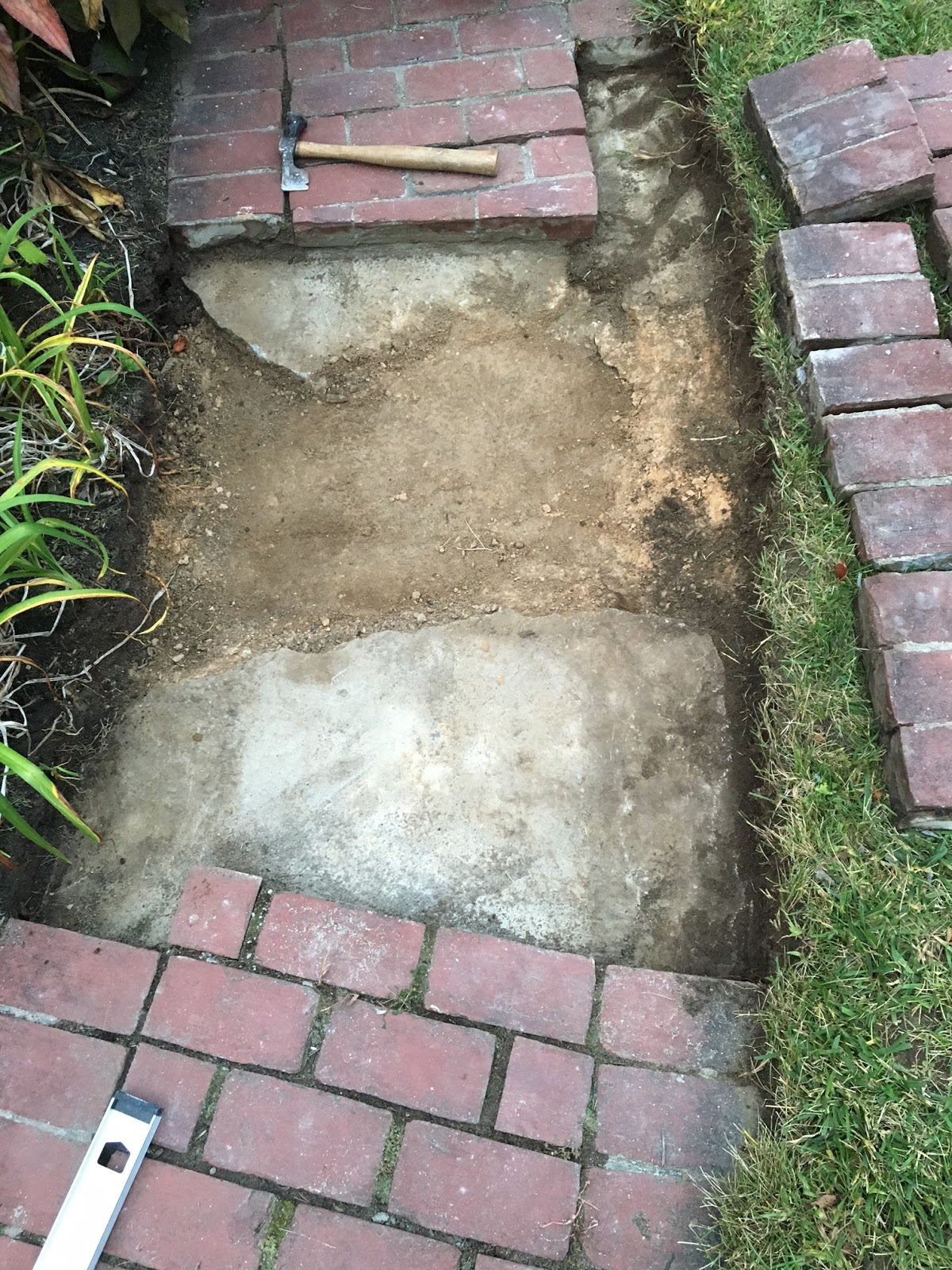 An Old Farm Leveling An Old Brick Walkway