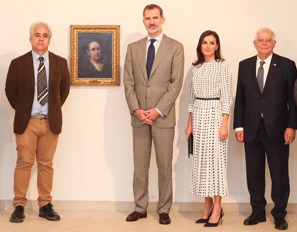 Queen Letizia wore a print dress by Massimo Dutti. Massimo Dutti print dress. Hugo Boss fanila clutch, Carolina Herrera shoes