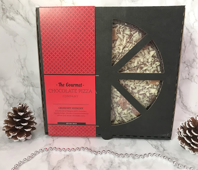 black box with a small chocolate pizza inside 