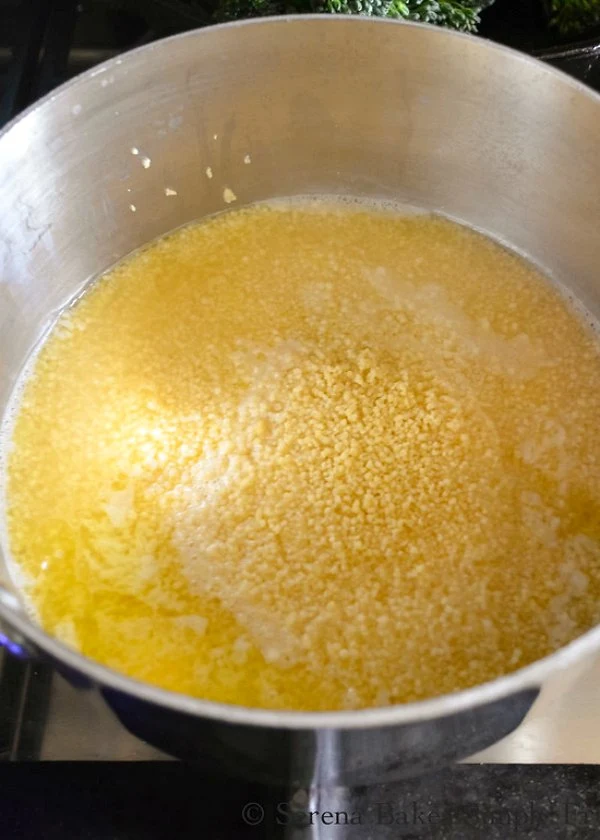 Stir Couscous into Chicken Broth from Serena Bakes Simply From Scratch.