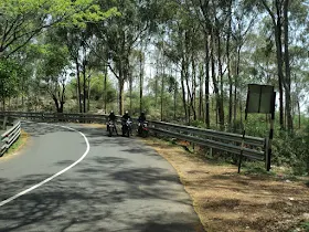 Riders enjoying the sudden drizzle near Hosur