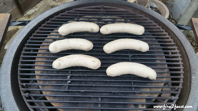 six bratwurst sausages on the grill