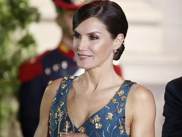Queen Letizia wore a new floral-print v-neck sleeveless midi dress by Carolina Herrera.
