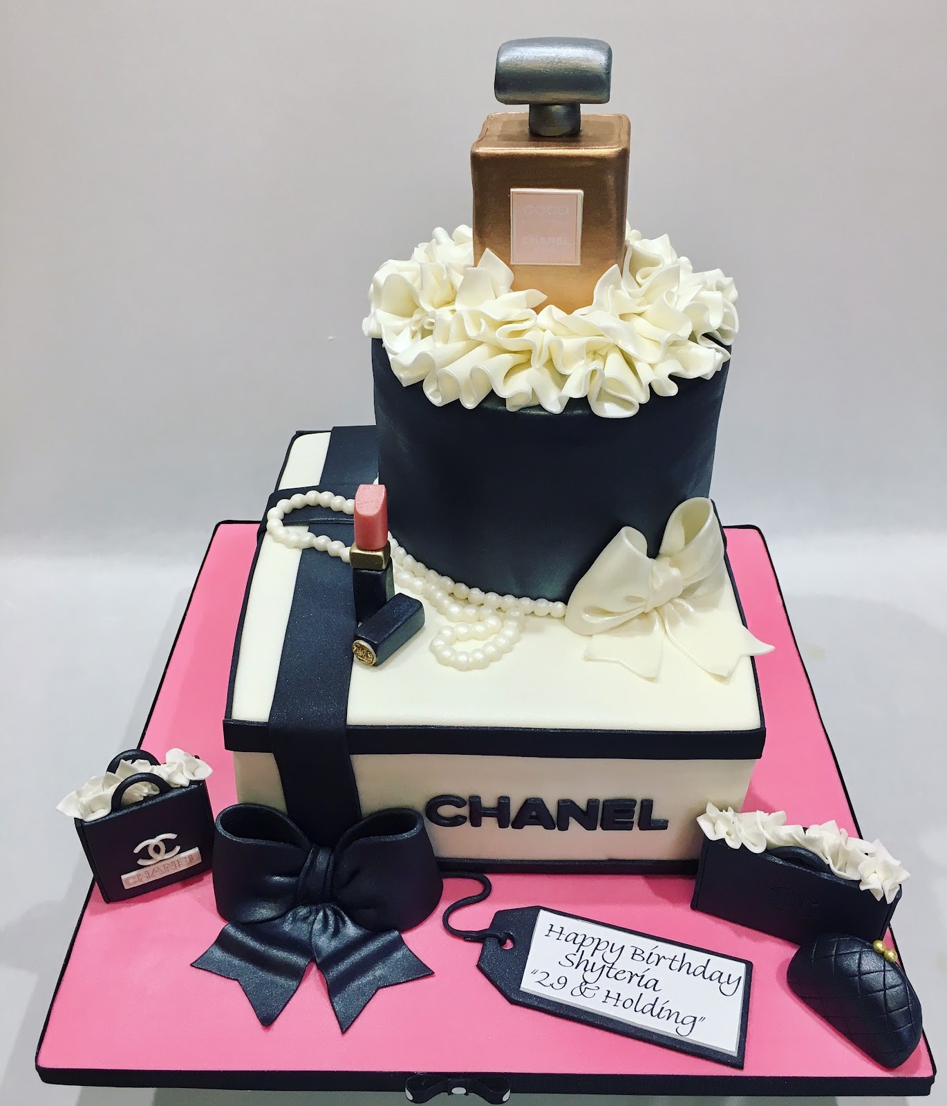 MyMoniCakes Chanel gift box cake with perfume and make up sculptures
