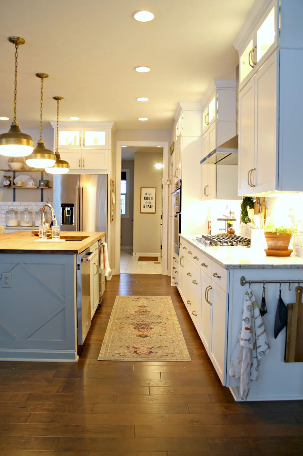 Long kitchen with white cabinets