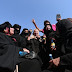 Photos of Syrians celebrating freedom from ISIS by burning niqabs and cutting beards