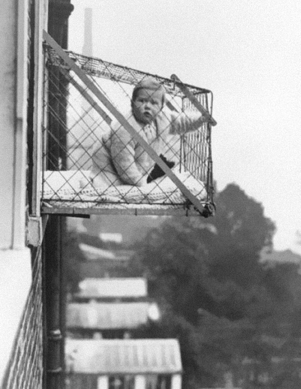 Baby cages used to ensure that children get enough sunlight and fresh air when living in an apartment building, ca. 1937-1 Baby cages used to ensure that children get enough sunlight and fresh air when living in an apartment building, ca. 1937-1