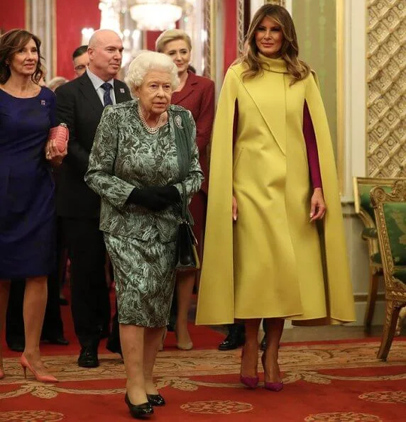 Kate Middleton wore a new emerald-green dress by Emilia Wickstead. The Duchess of Cornwall and First Lady Melania Trump