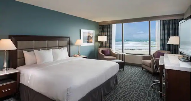 Book your stay at the Hilton Oceanfront Cocoa Beach hotel on Florida's Space Coast, steps from beautiful beaches and minutes from Port Canaveral and KSC.