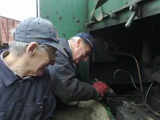 Brian & Ronnie repairing an air leak on the Husky