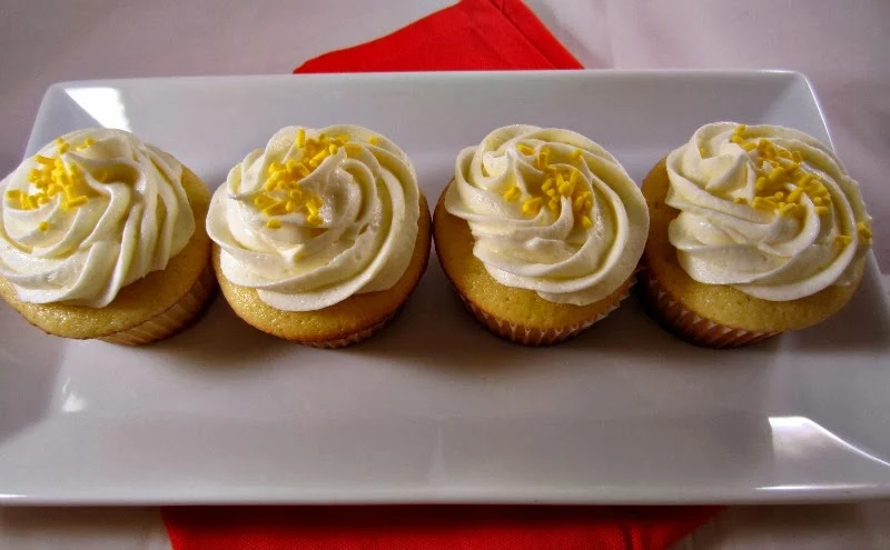 Renee's Kitchen Adventures:  Sweet Orange Cupcakes with Orange Butter Cream Frosting.  A light and moist cupcake bursting with orange flavor!  #cupcakes
