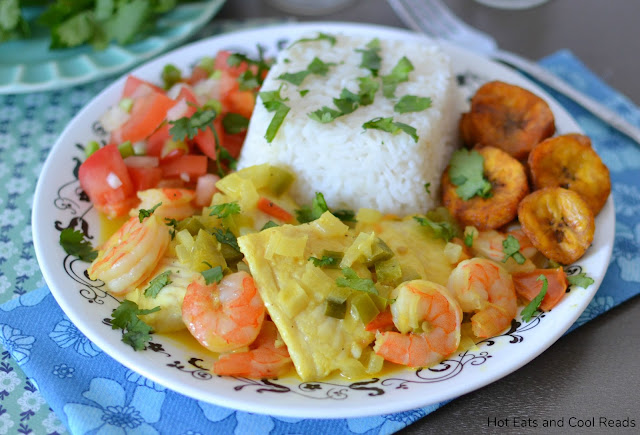 Colombian Fish and Shrimp in Coconut Sauce Recipe from Hot Eats and Cool Reads! This dinner recipe is so unique and flavorful! Best when served with chopped tomatoes and onions, fried plantains and rice!