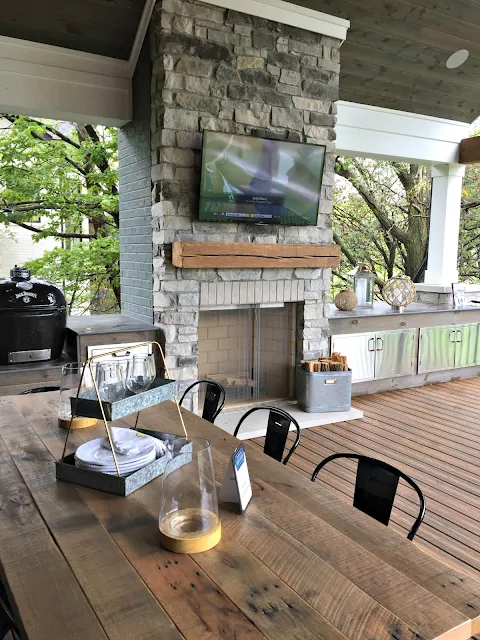 outdoor covered deck with fireplace