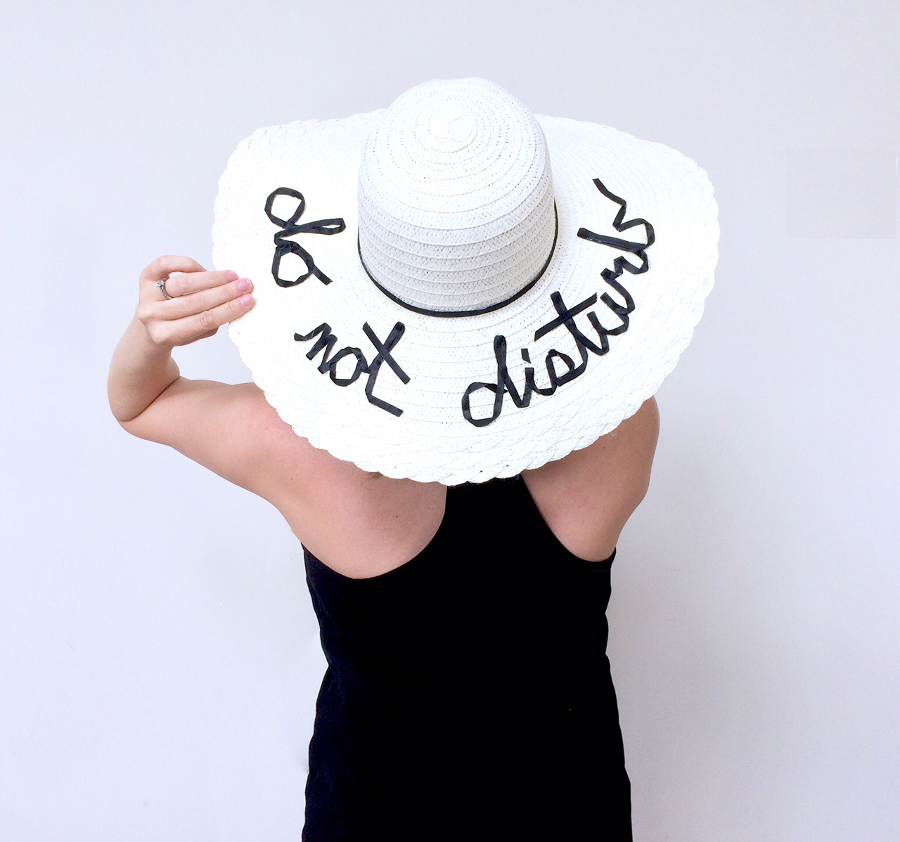 floppy hat with writing