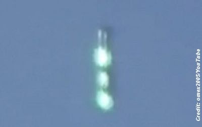 Cigar-Shaped UFO Caught on Video hovering Above Manchester, England 7-9-11