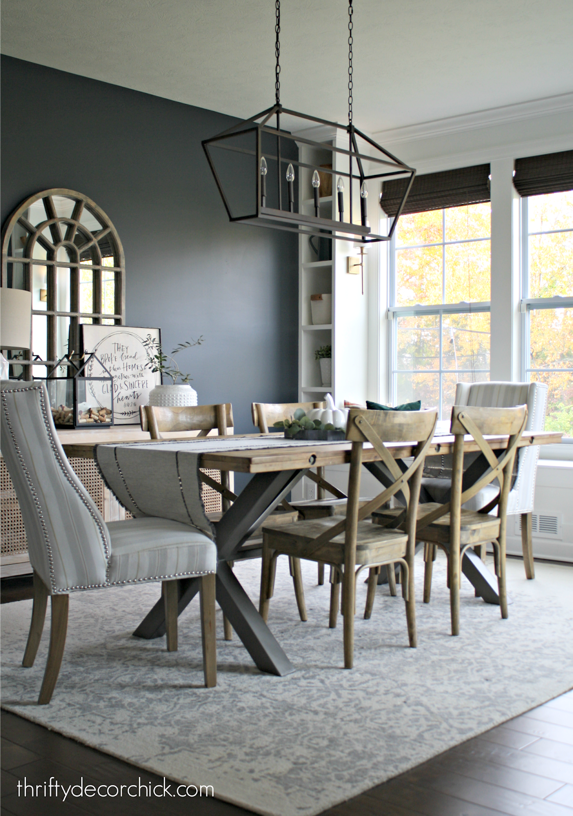 Dark walls with white built ins in dining room 