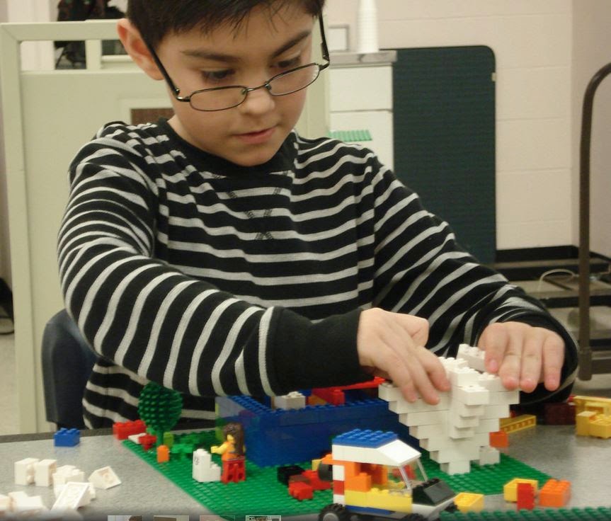 Kid building LEGO tornado at Davis Kid building LEGO tornado at Davis