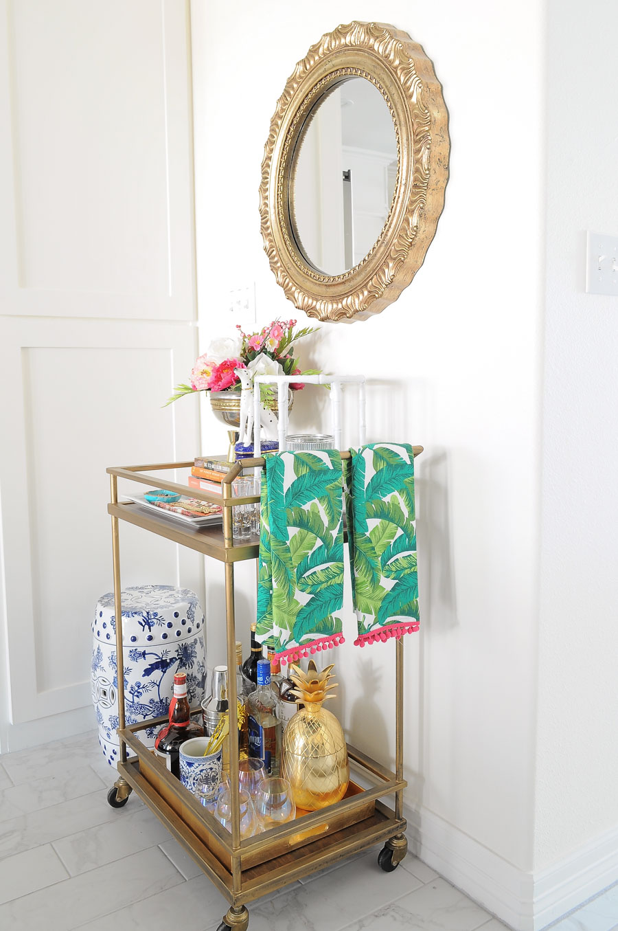A gold bar cart looks stylish and chic for spring with touches of pink, gold, florals and chinoiserie vibes. A gold bar cart looks stylish and chic for spring with touches of pink, gold, florals and chinoiserie vibes.