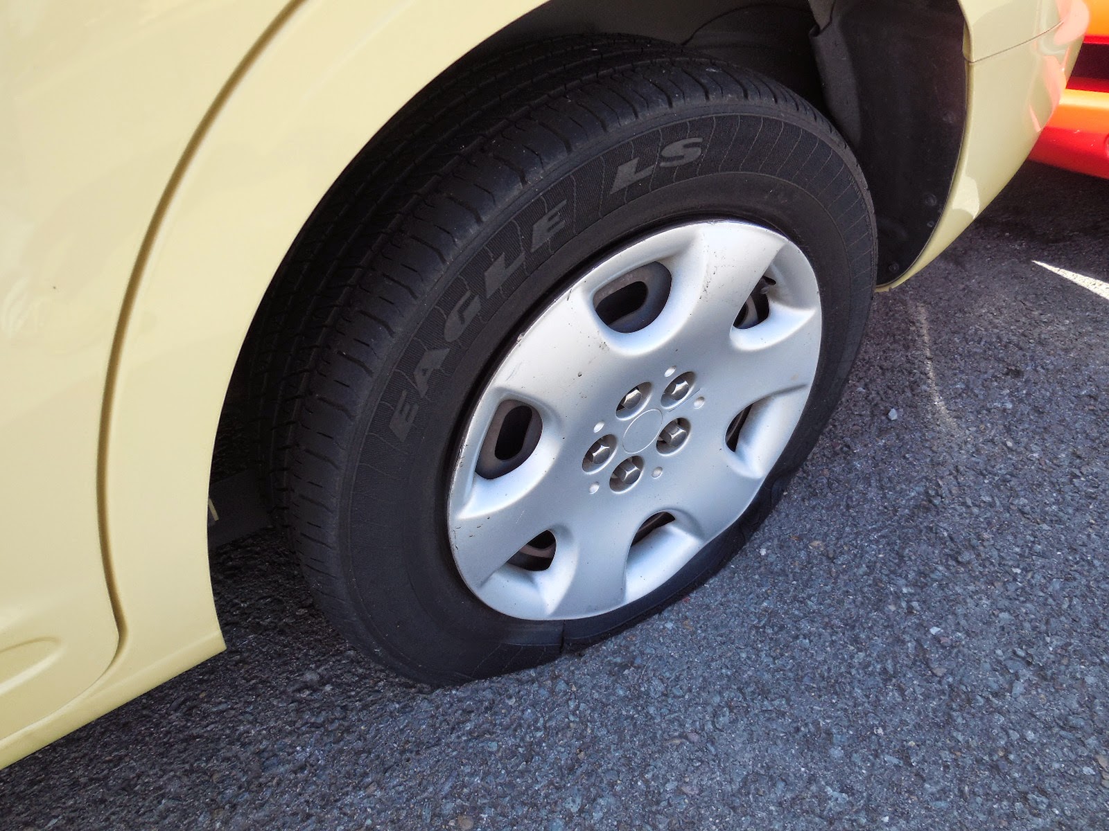 Just A Car Guy Someone slashed the tires on this PT Cruiser... strange