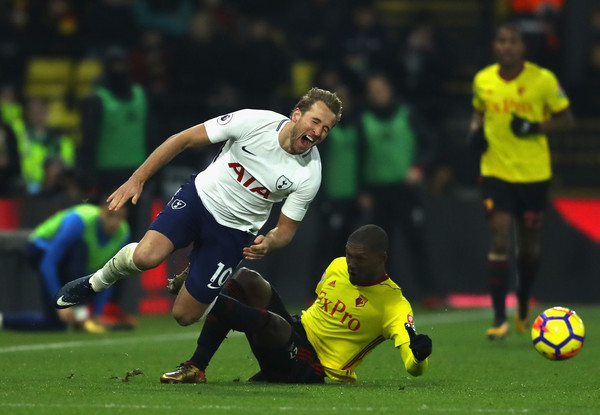 Christian Kabasele of Watford fouls Harry Kane of Tottenham Hotspur during the Premier League match between Watford and Tottenham Hotspur at Vicarage Road on December 2, 2017 in Watford, England. (Dec. 1, 2017 - Source: Richard Heathcote/Getty Images Europe)