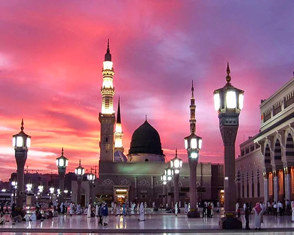 Madinah city skyline with Islamic architecture and prayer call from minarets