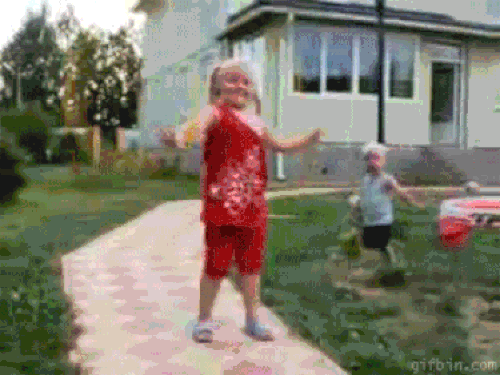 Watch the child! He streaked past his brother who was playing hoolahoop